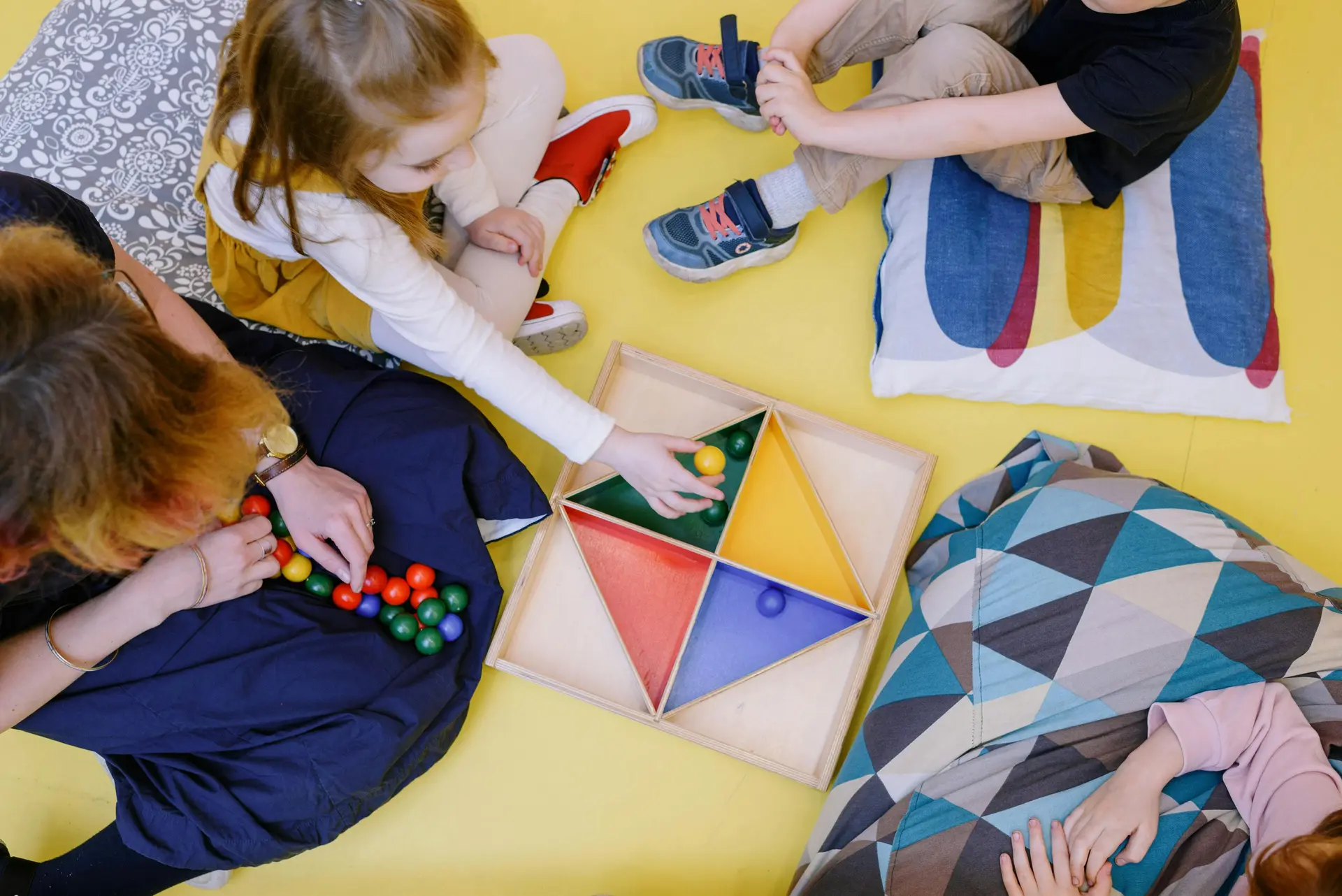 Child using Montessori educational materials for early mathematics development